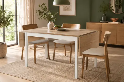Table à manger pliante VASAGLE bicolore, ouverte dans une salle à manger lumineuse et chaleureuse